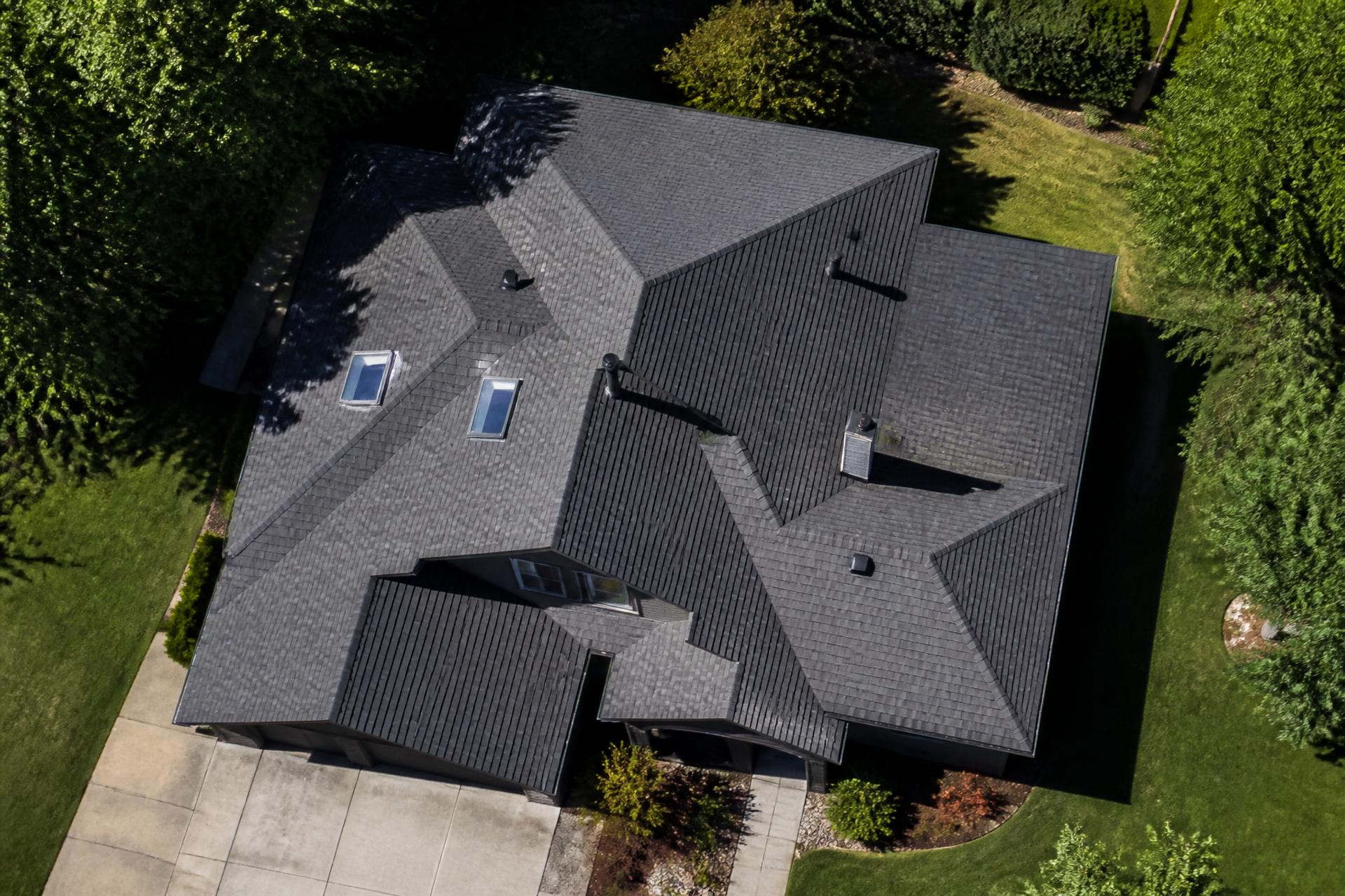 Aerial satellite roof measurement with blueprint dimension overlay